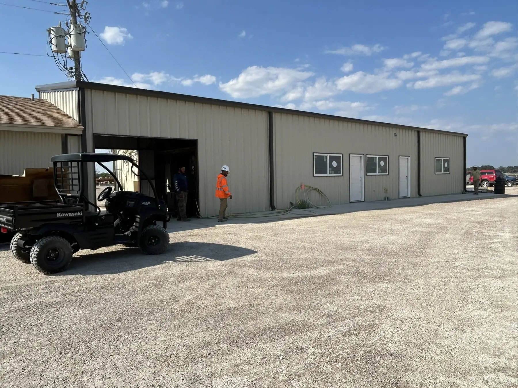 Long commercial building with office end — built by Rodriguez Metal Buildings, Central Texas
