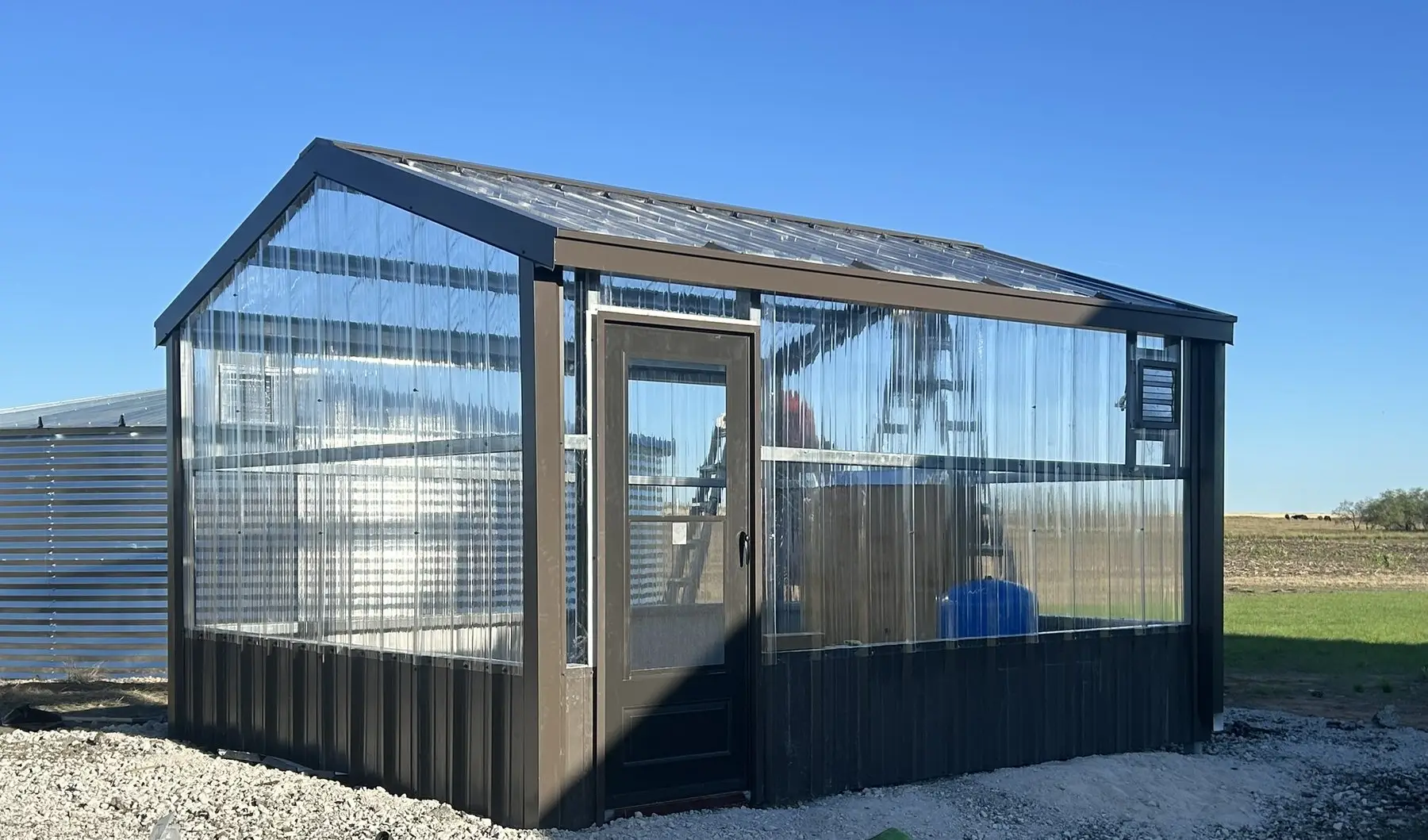 Custom glass-panelled structure — built by Rodriguez Metal Buildings, Central Texas