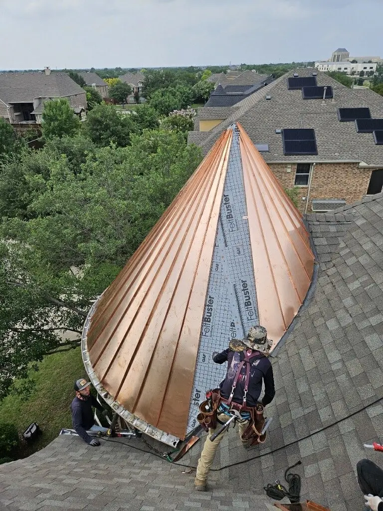 Copper standing seam on a conical turret — built by Rodriguez Metal Buildings, Central Texas